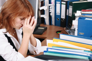 A woman has migraine in office